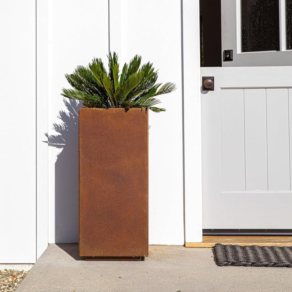 A rectangular outdoor planter box with plants